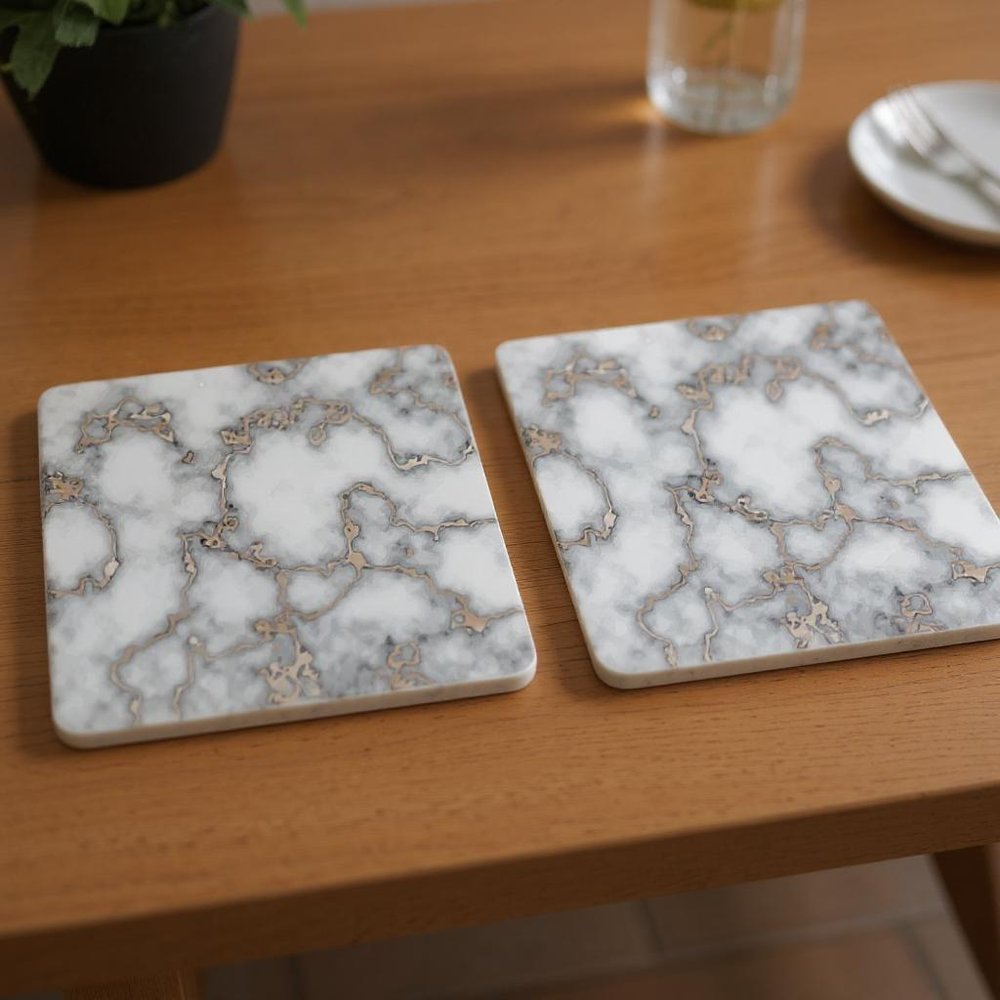15" X 15" Gray And Gold Abstract Agglomerated cork Square Placemats styled in a furnished interior with a mahogany wall on a dark wood floor.