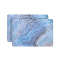18" Set of Two Blue Abstract Faux Marble Cork Placemats. Dining linen isolated on a plain white background, in a blue linen finish.