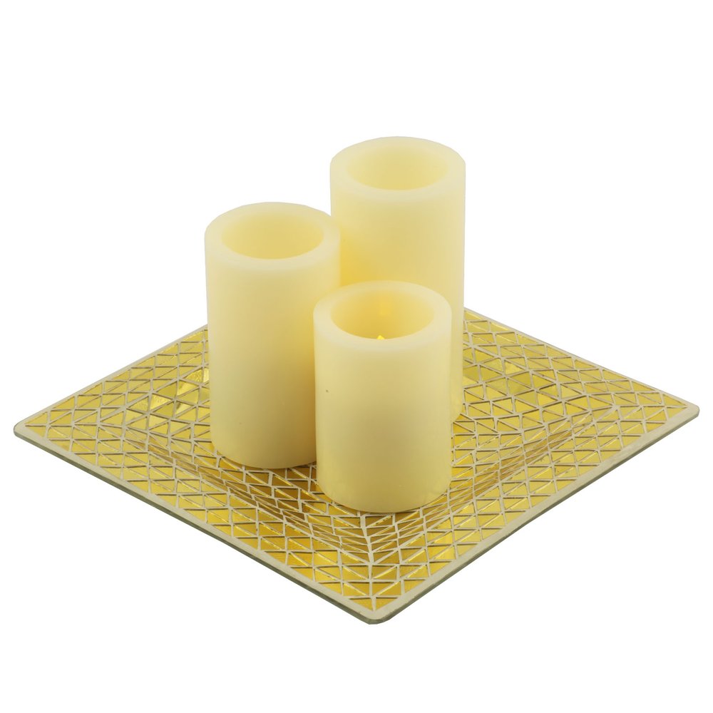 Three ivory flameless pillar candles on a square gold mosaic holder against a white background.