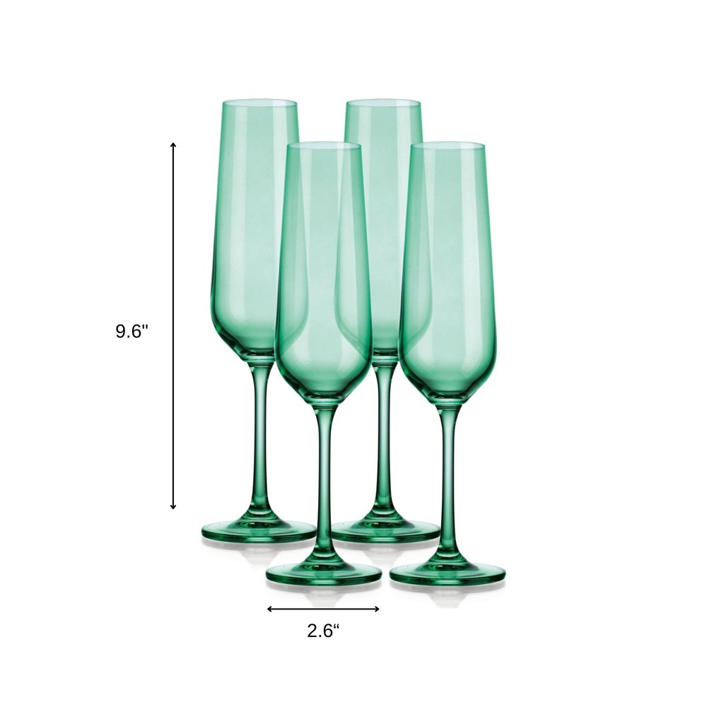 Set of Four Green Crystal Narrowing Shape Stemmed Flute on a white background