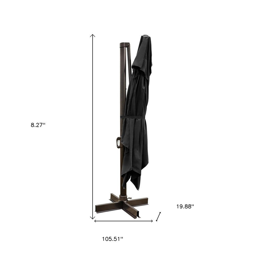 13' Black Polyester Rectangular Tilt Cantilever Patio Umbrella with Stand. Outdoor umbrella isolated on a plain white background, finished in black fabric.