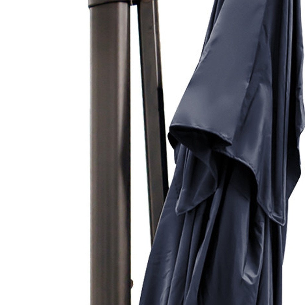 13' Navy Blue Polyester Rectangular Tilt Cantilever Patio Umbrella with Stand. Outdoor umbrella isolated on a plain white background, in a navy fabric finish.