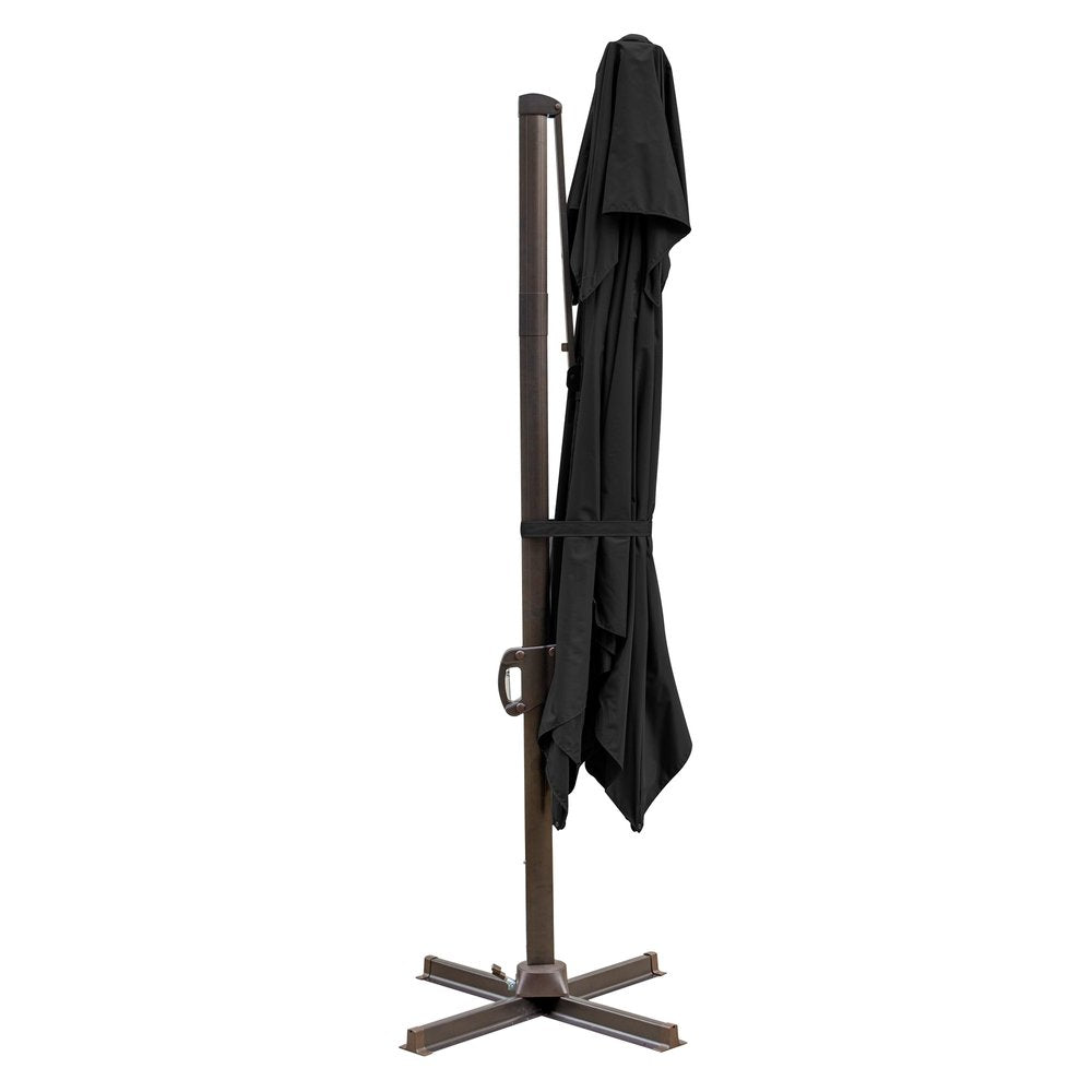Black polyester cantilever patio umbrella with a bronze stand, folded and tied, on a white background.