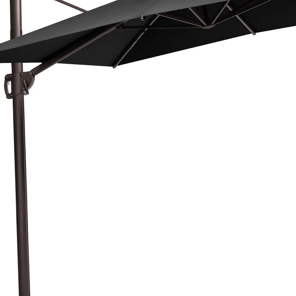 11' Black Polyester Round Tilt Cantilever Patio Umbrella with Stand. Outdoor umbrella isolated on a plain white background, finished in black fabric.