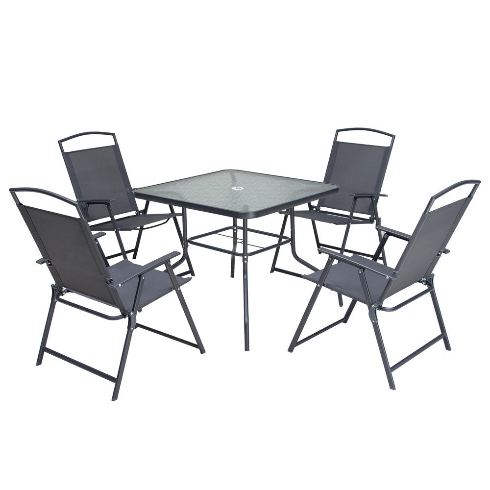 Square glass dining set with four black fabric and metal chairs on a white background.