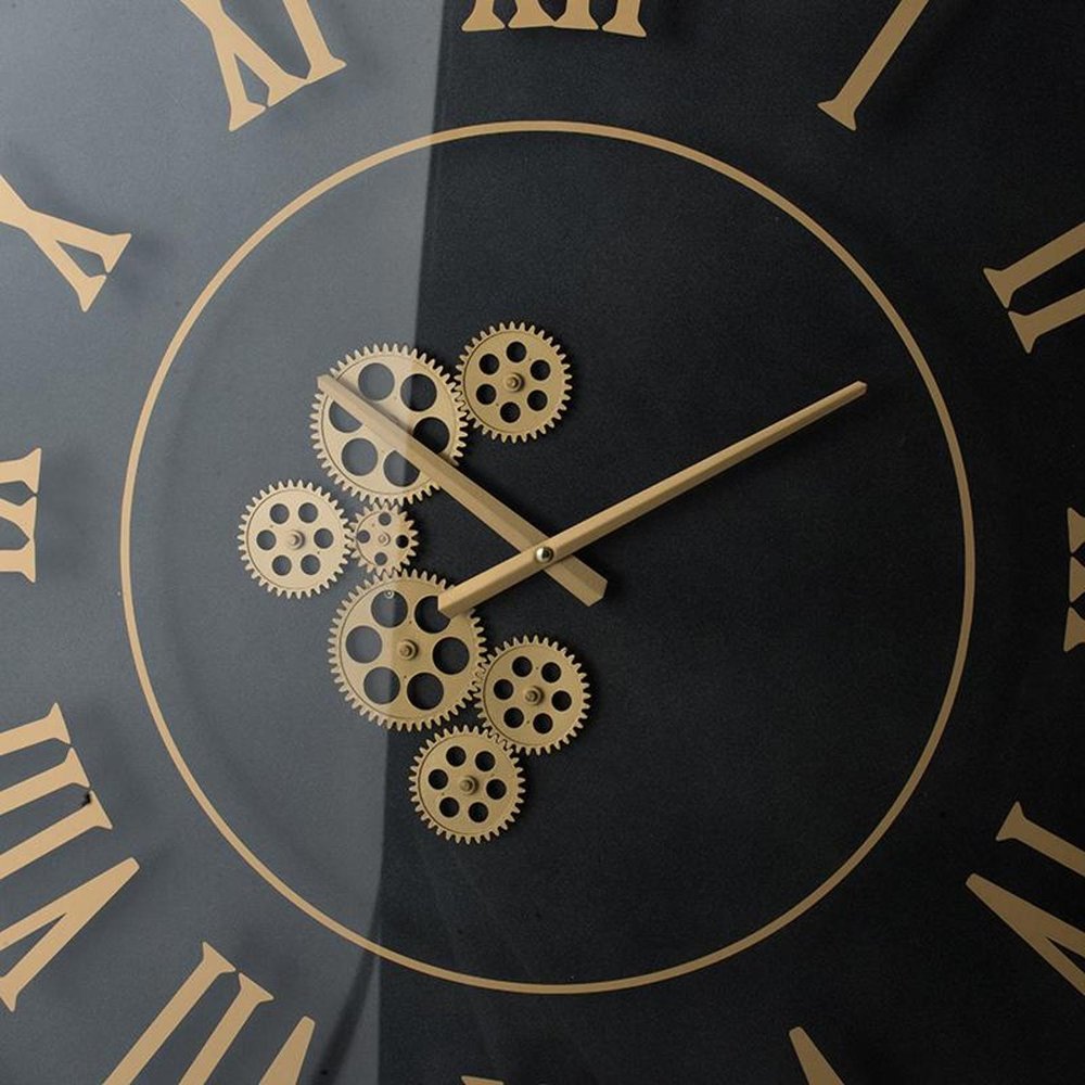 35" Black And Gold Glass And Metal Exposed Gear Square Wall Clock photographed against a dark studio background in black.