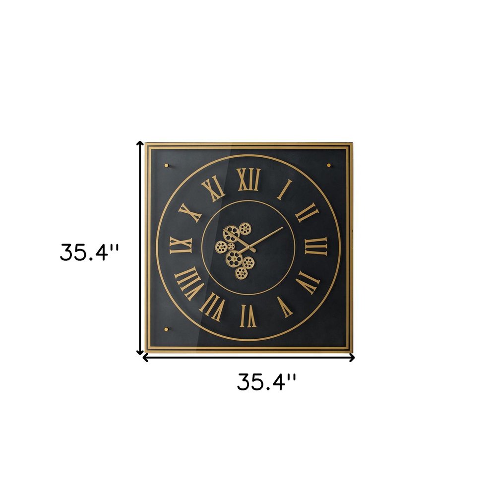 35" Black And Gold Glass And Metal Exposed Gear Square Wall Clock. Wall clock isolated on a plain white background, finished in black glass.