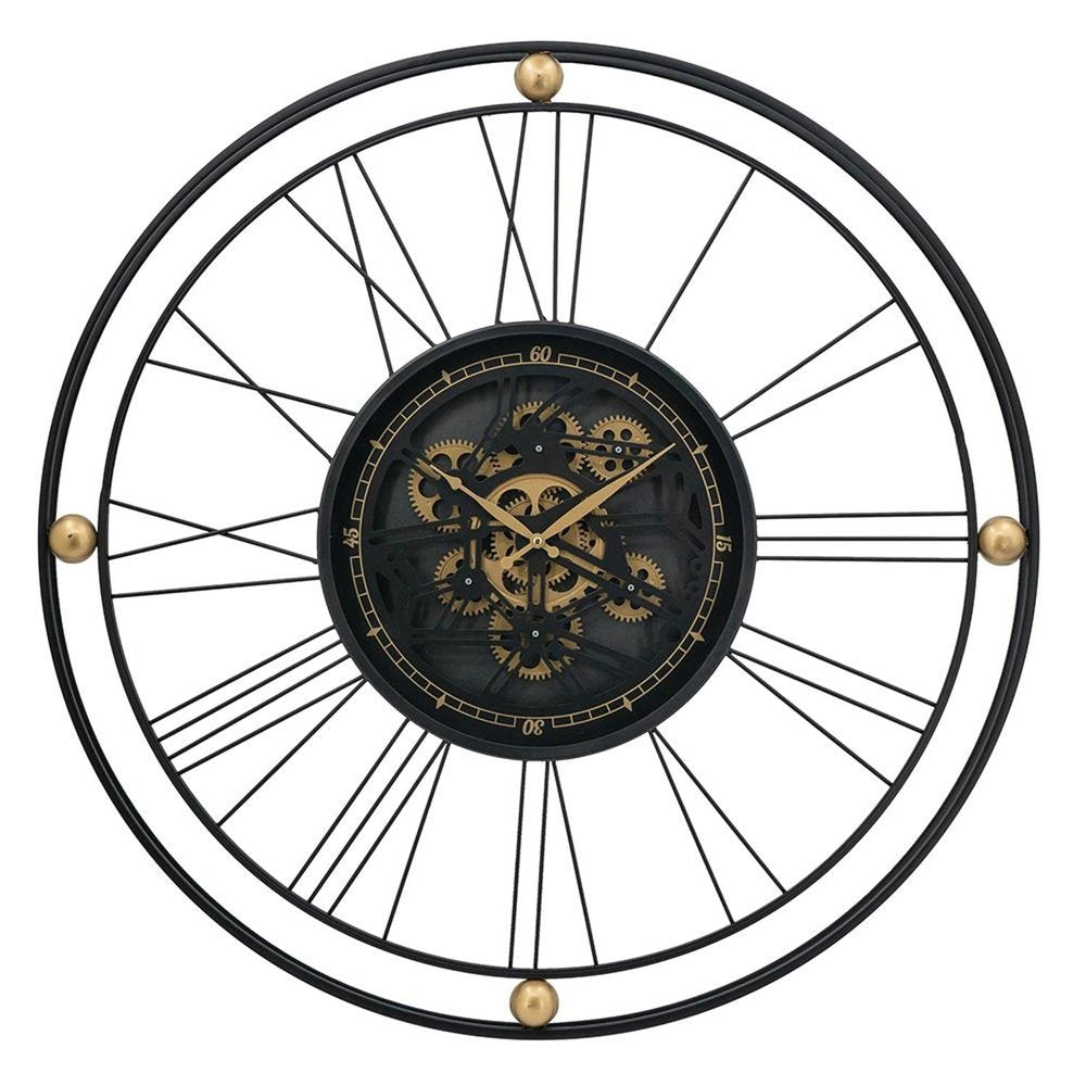 Black and gold metal analog wall clock with exposed gears and Roman numerals on a white background.