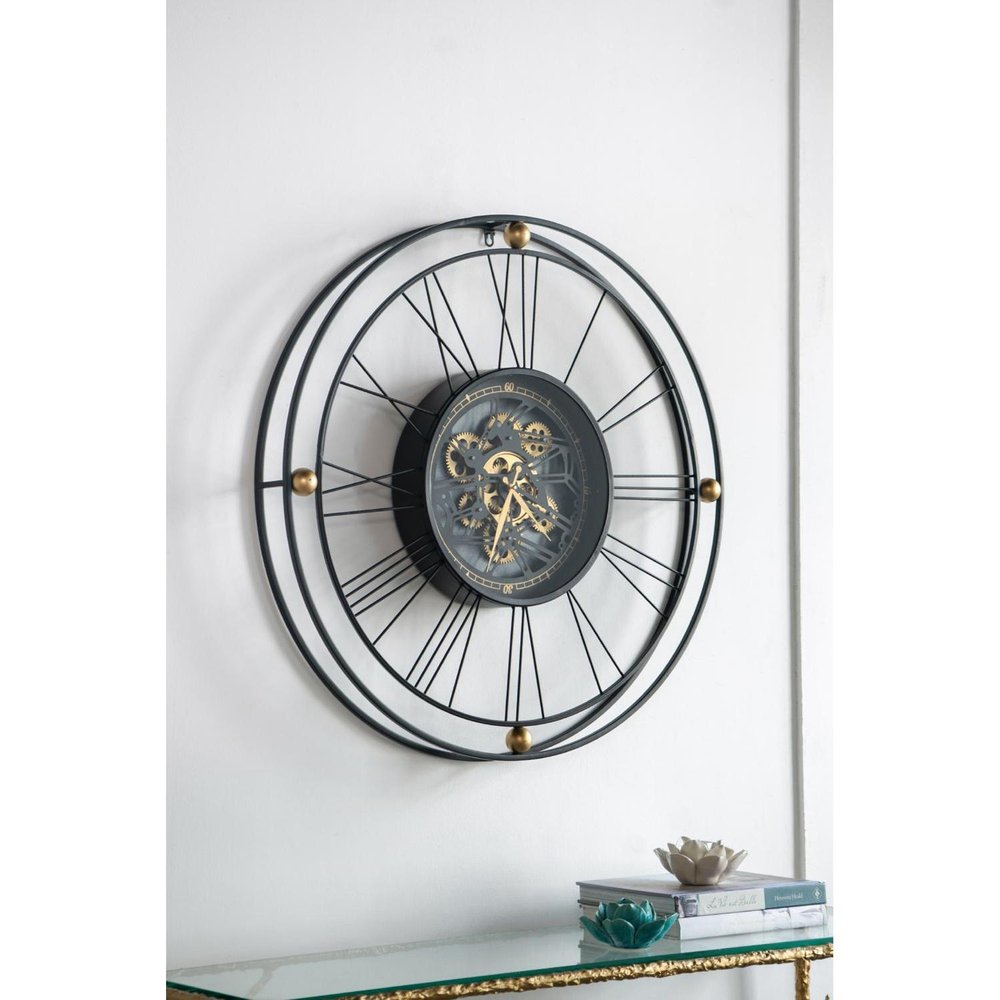 32" Circle Black and Gold Metal and Glass Analog Exposed Gear Wall Clock. Wall clock isolated on a plain white background, showing a glass surface.