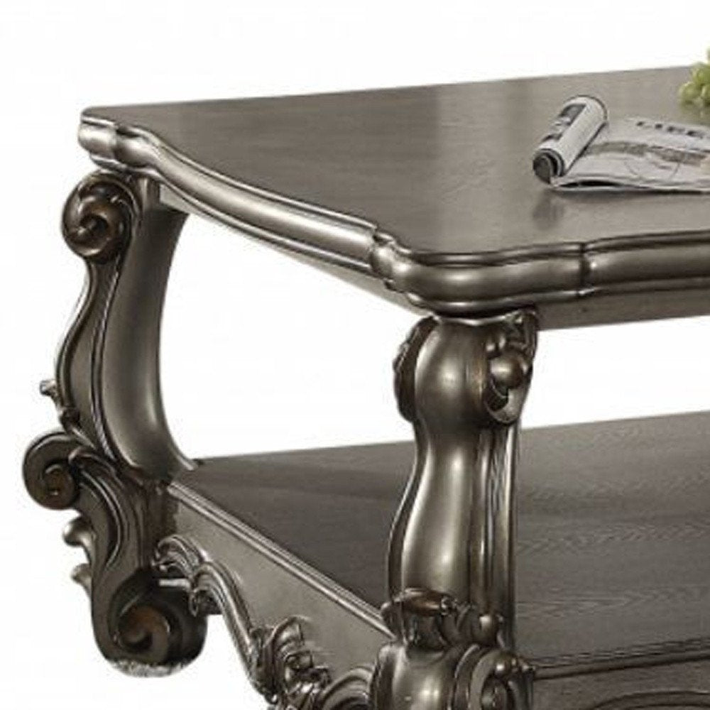 59" Gray Wood And Polyresin Coffee Table With Shelf. Coffee table isolated on a plain white background, showing a gray resin surface.