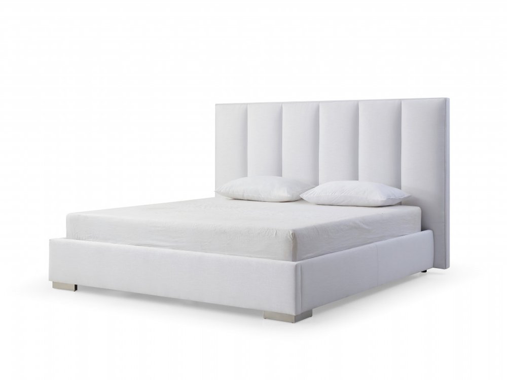 White upholstered queen bed frame with ribbed headboard and two pillows on a white background.