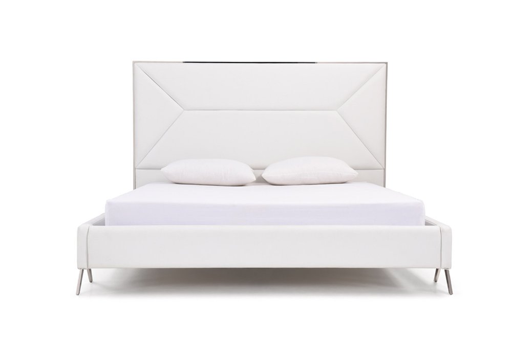 White upholstered king bed frame with tufted headboard and two pillows on a white background.