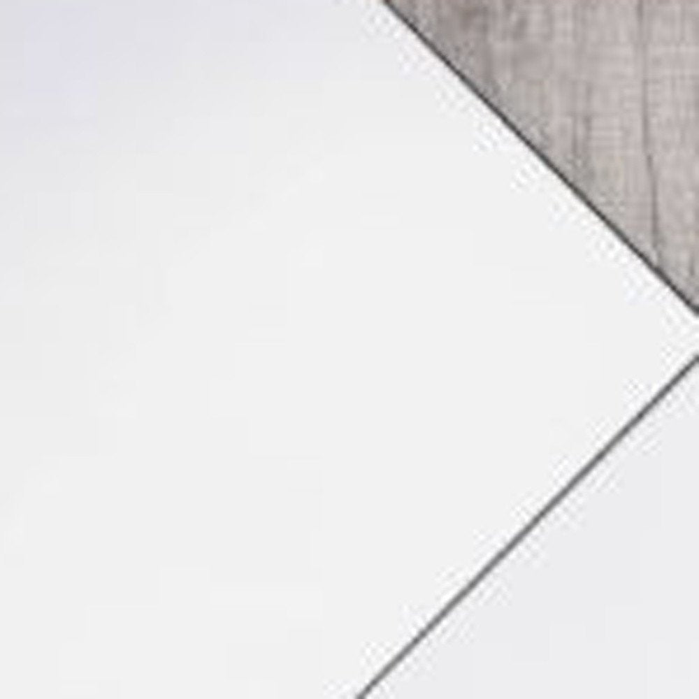Two natural metal framed accent mirrors on a grey wooden background.