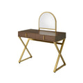 A wooden vanity table with a gold metal frame and arched mirror sits on a white background.