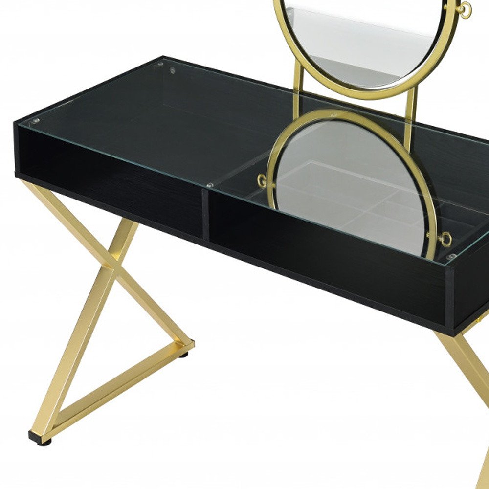 42" Black And Gold Glass and Wood Mirrored Vanity Table. Vanity table isolated on a plain white background, in a black glass finish.