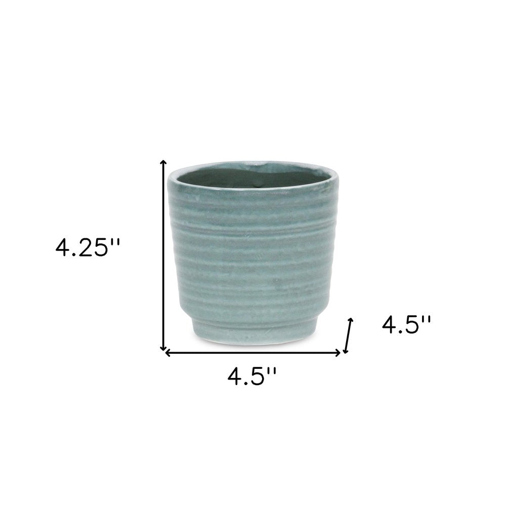 Green Ceramic 23 Ounce Striped Round Distressed Pot Planter on a white background