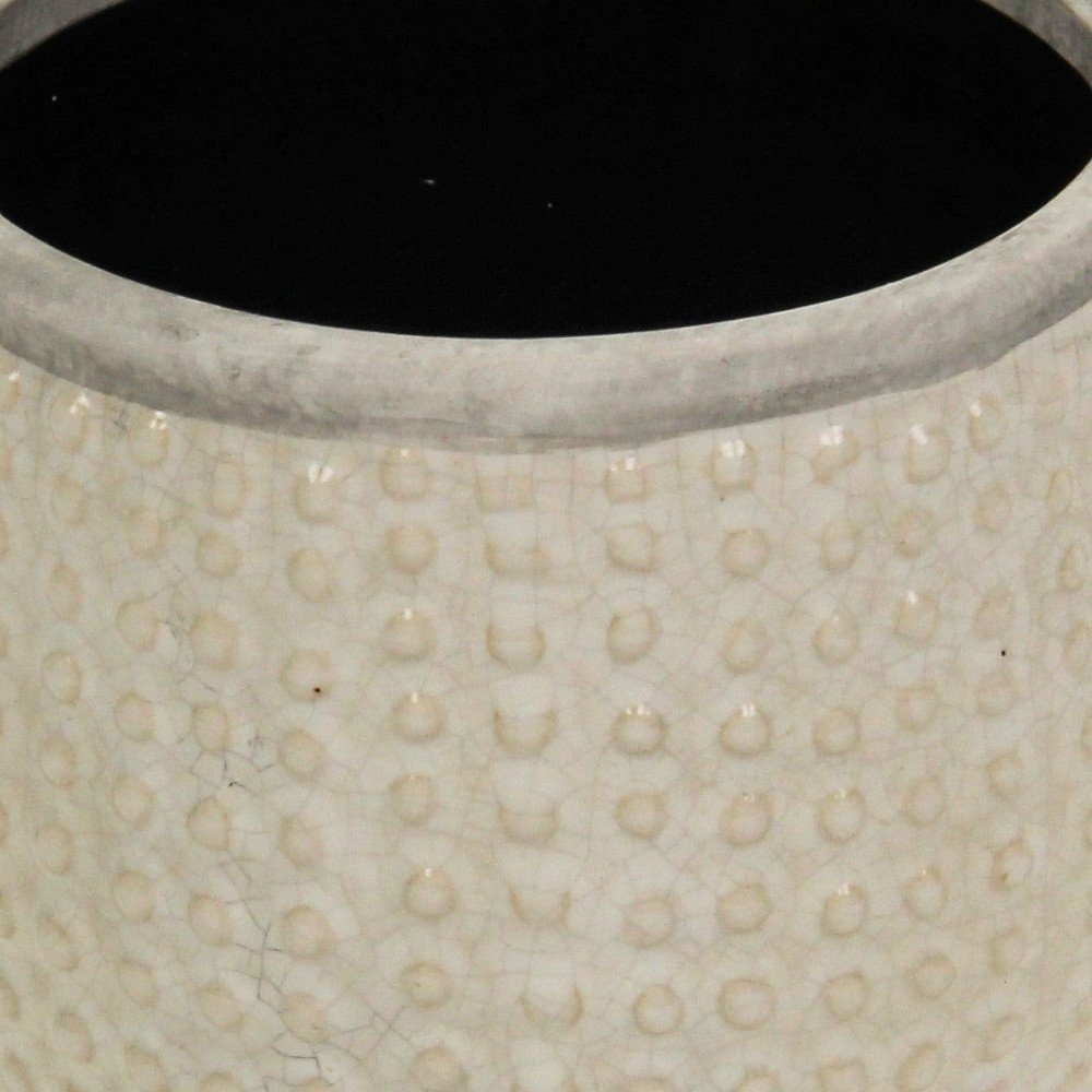 Detail view of 6" Beige Dot Ceramic Indoor Outdoor Round Pot Planter, filling the frame with the beige ceramic texture.