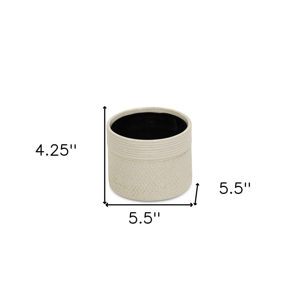 Off White Ceramic 42 Ounce Dotted Round Distressed Pot Planter on a white background