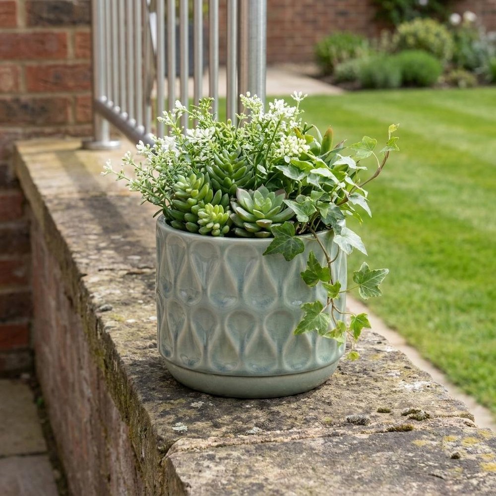 7" Green Geometric Ceramic Indoor Outdoor Round Pot Planter in a home interior