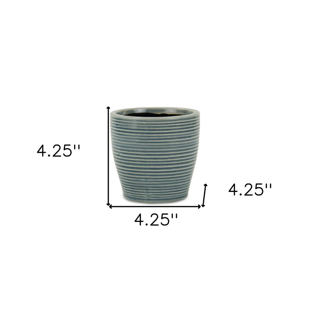 Blue Ceramic 22 Ounce Striped Round Distressed Pot Planter on a white background