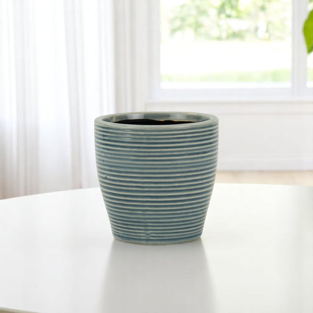 Blue Ceramic 22 Ounce Striped Round Distressed Pot Planter on a white background