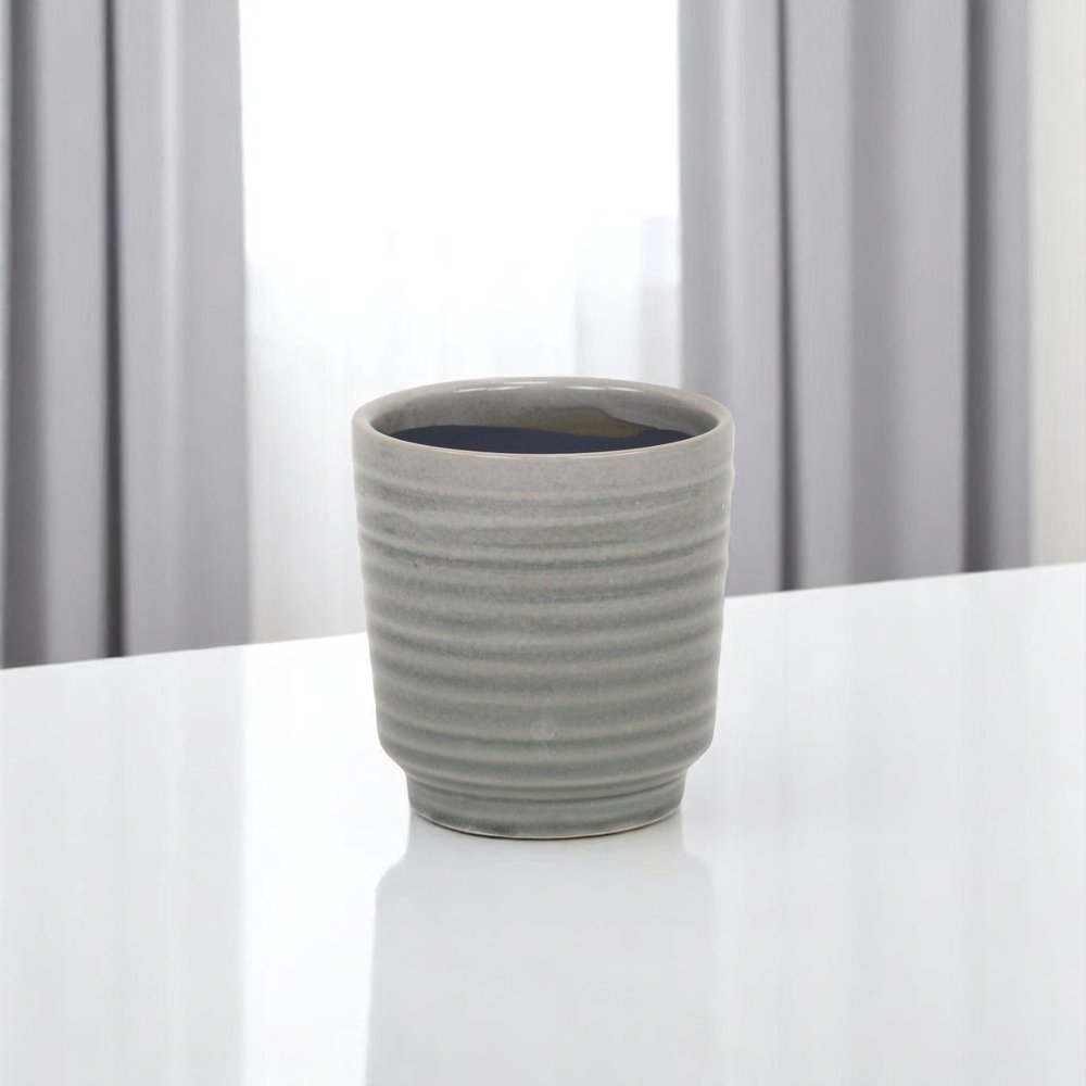 Gray Ceramic 19 Ounce Striped Round Distressed Pot Planter on a white background