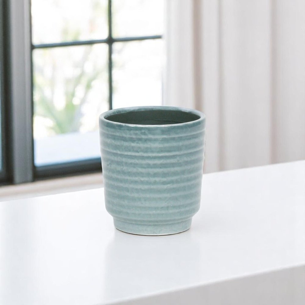 Green Ceramic 15 Ounce Striped Round Distressed Pot Planter on a white background