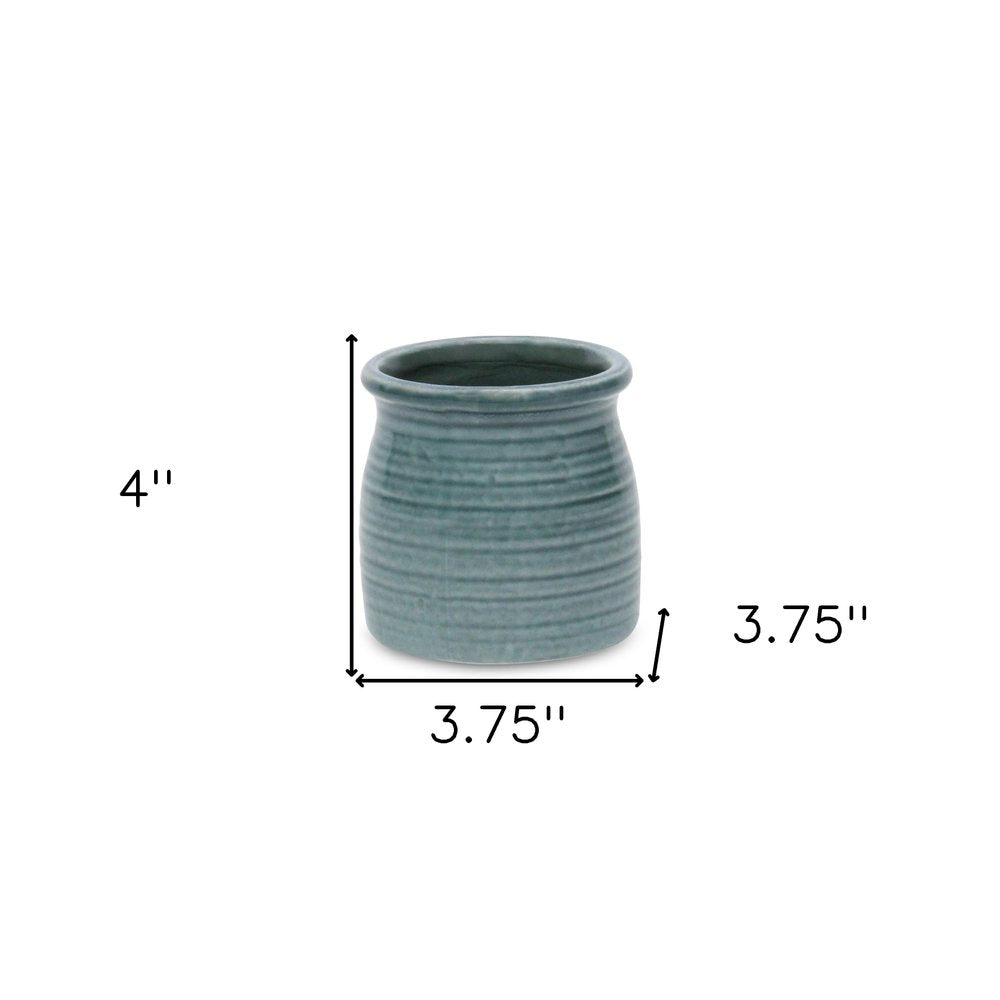 Green Ceramic 12 Ounce Striped Round Distressed Pot Planter on a white background