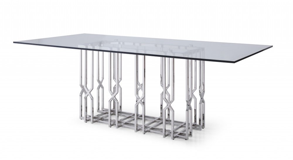 Rectangular glass dining table with a polished stainless steel pedestal base on a white background.