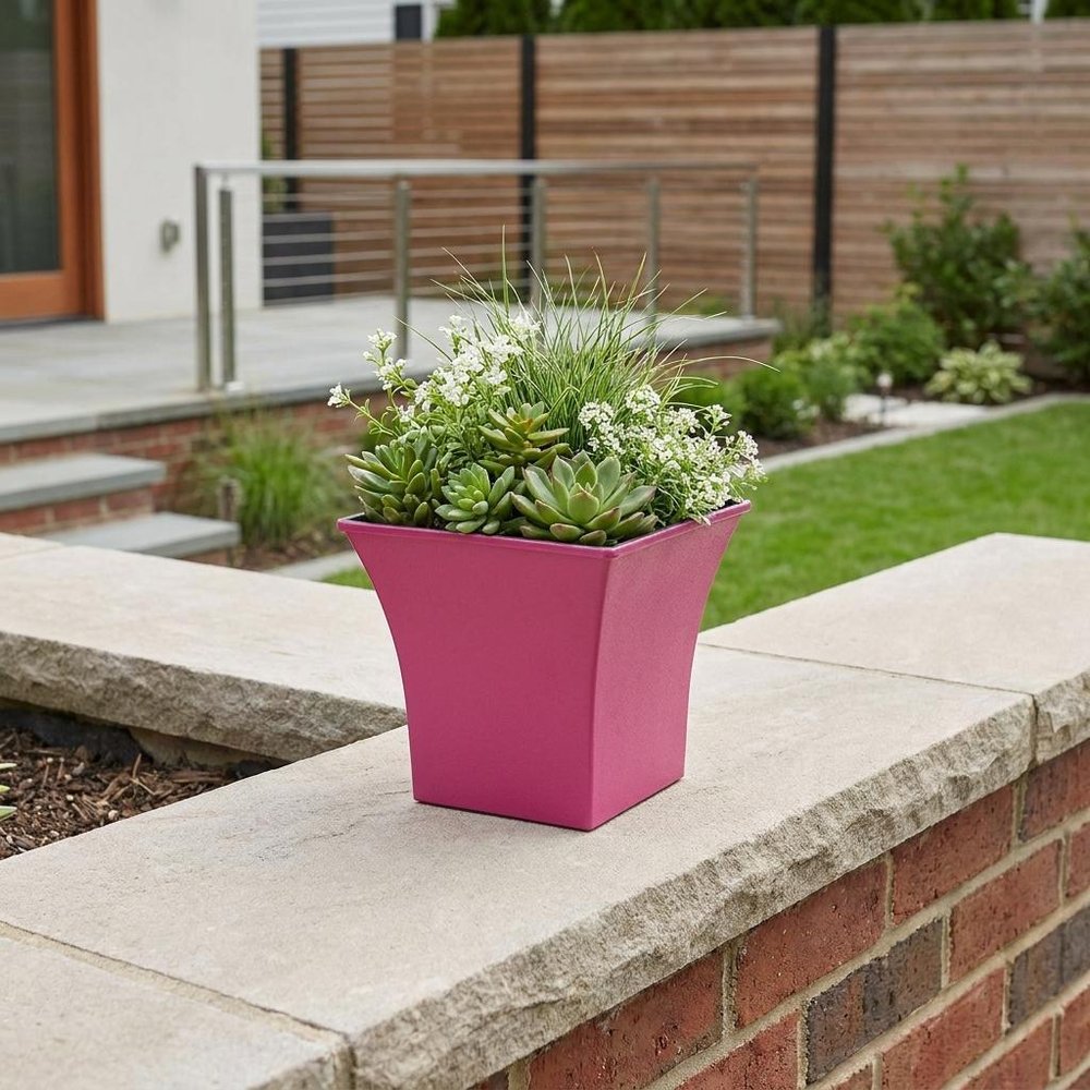 5" Hot Pink Recycled Plastic Indoor Outdoor Square Pot Planter shown outdoors on a patio with greenery.