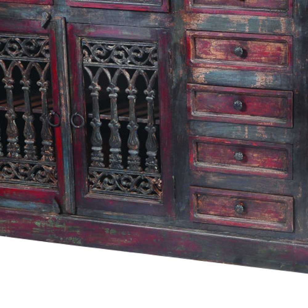 Antique-style buffet table with distressed red and black finish, featuring nine drawers and four ornate doors.