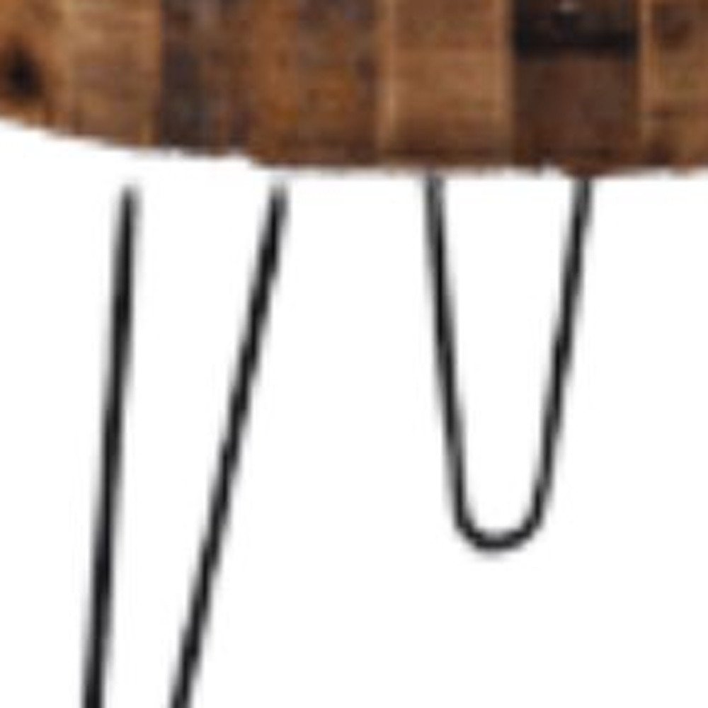 Close-up of two round end tables with natural brown wood tops and black iron hairpin legs on a white background.