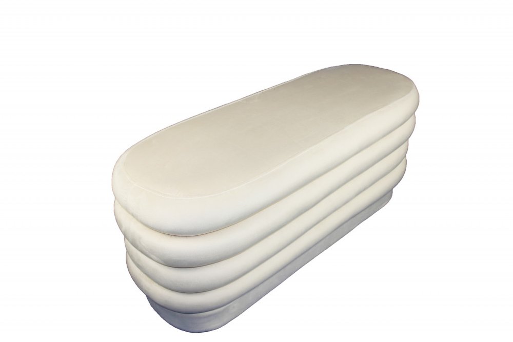 44" White Velvet Tufted Oval Ottoman. Ottoman isolated on a plain white background, in a white velvet finish.