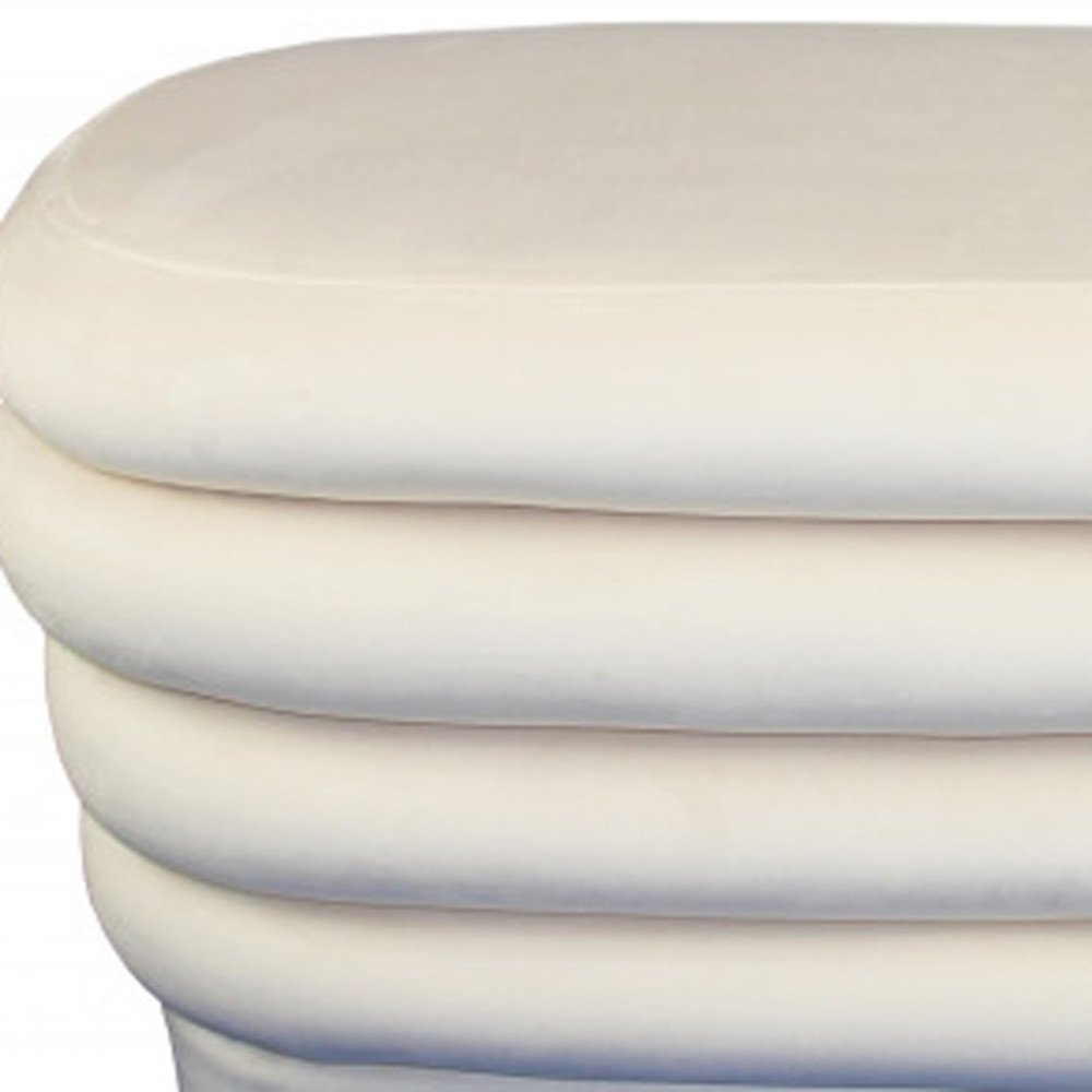 Close-up of 44" White Velvet Tufted Oval Ottoman showing the white velvet texture.