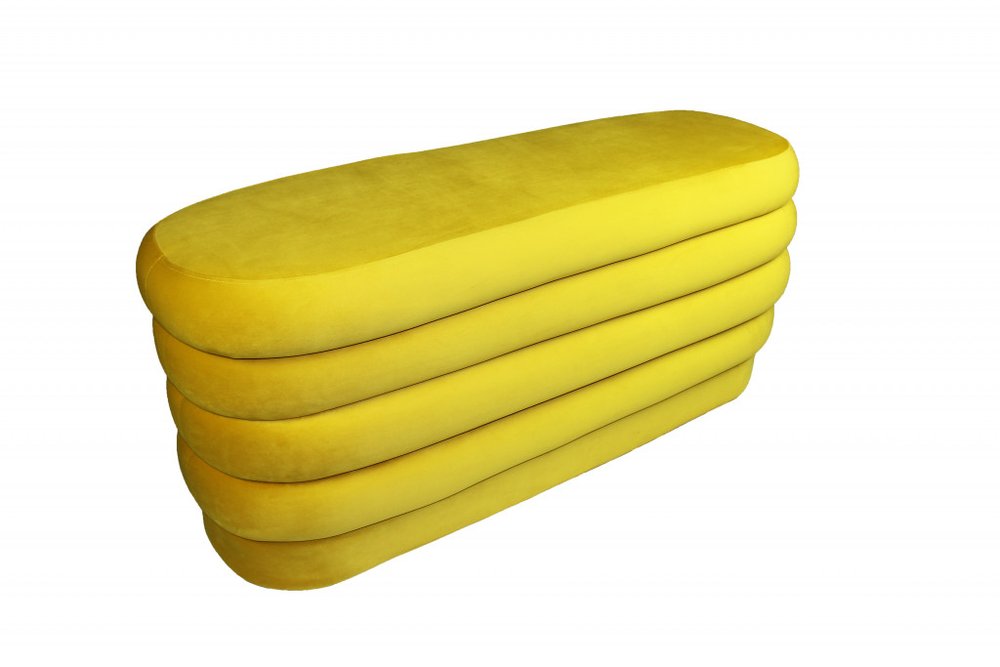44" Yellow Velvet Tufted Oval Ottoman. Ottoman isolated on a plain white background, in a yellow velvet finish.