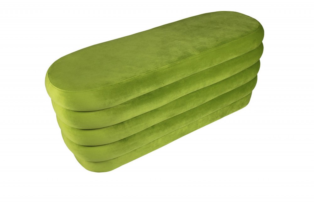 44" Green Velvet Tufted Oval Ottoman. Ottoman isolated on a plain white background, in a green velvet finish.