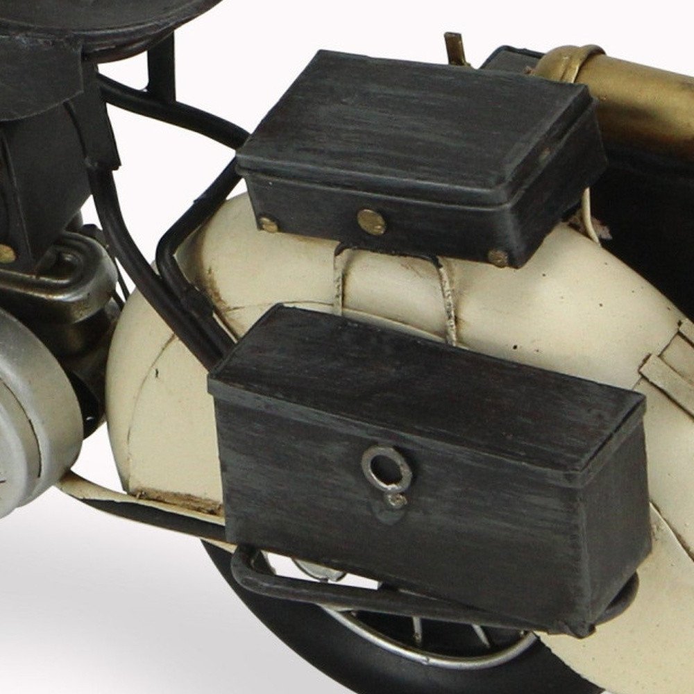 Cropped view of 10" Cream Metal Hand Painted Motorcycle Model Motorcycle focusing on the cream metal surface.