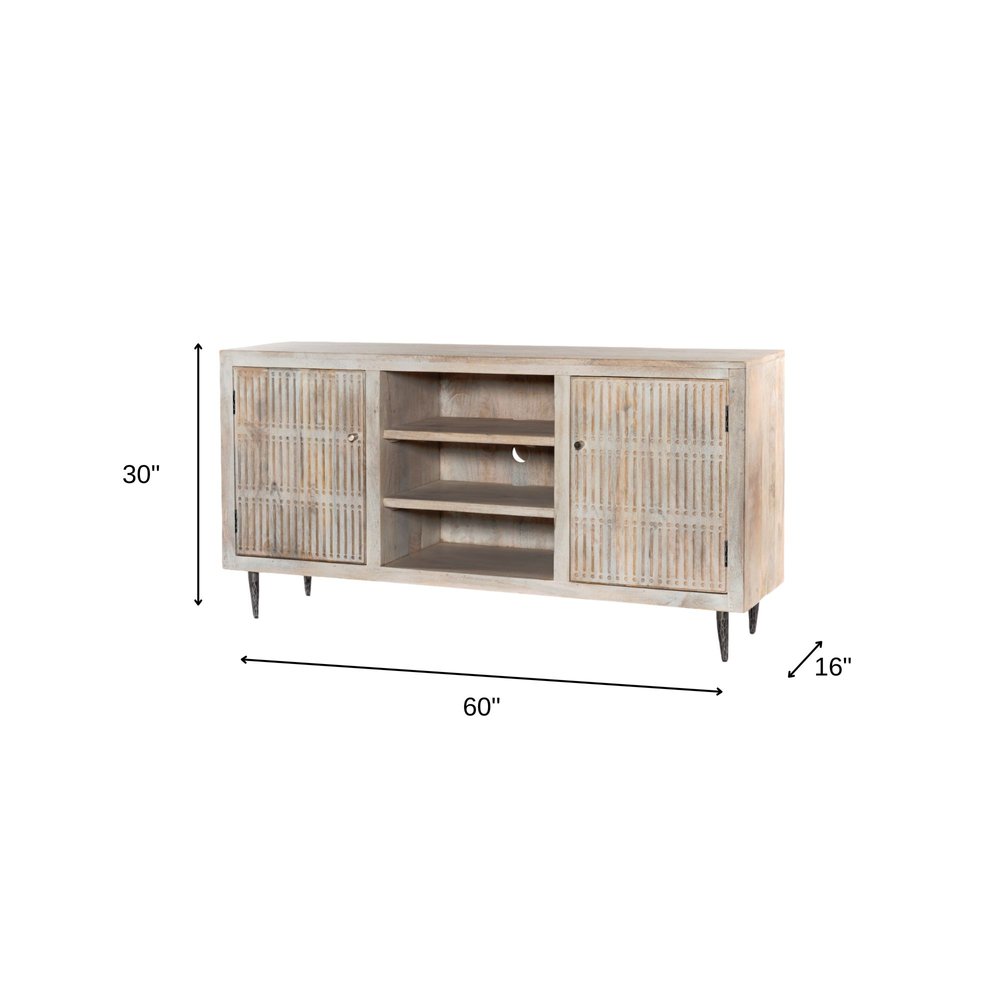 60" Ivory Carved Geometric Distressed Solid Wood Enclosed and Open Storage TV Stand. TV stand isolated on a plain white background, in a ivory wood finish.
