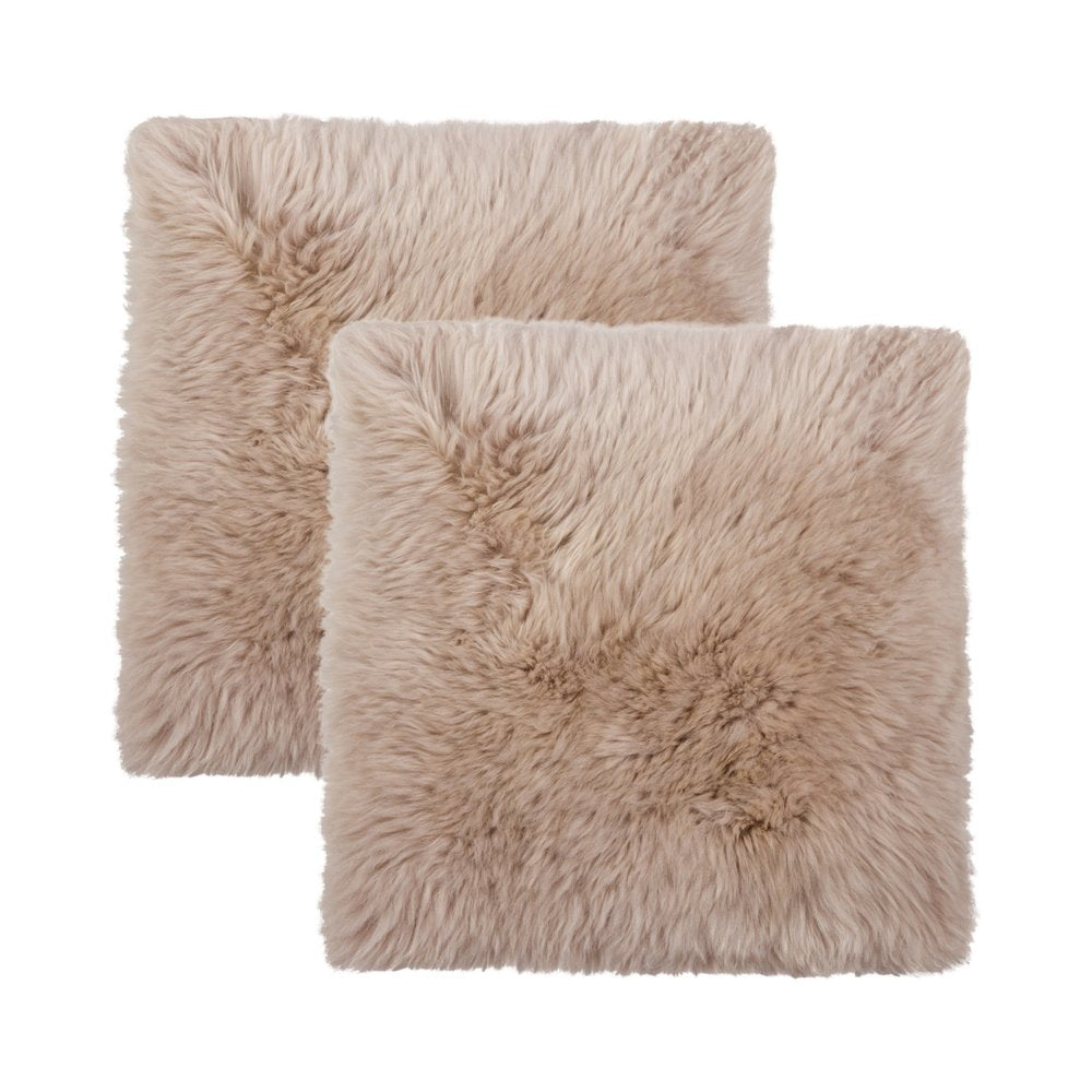 Two taupe wool chair pads with a fluffy texture on a white background.