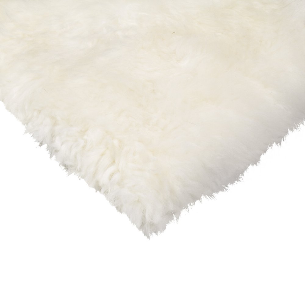 Set Of Four 17" X 17" Natural Wool Solid Color Chair Pads on a white background