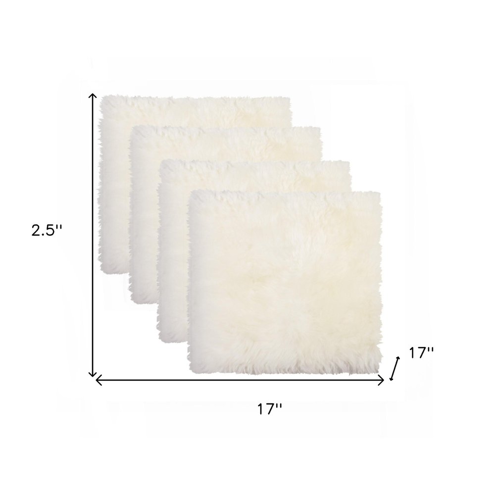Set Of Four 17" X 17" Natural Wool Solid Color Chair Pads on a white background