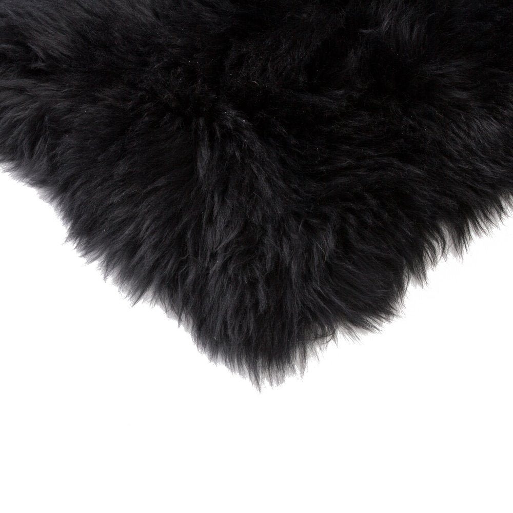 Set Of Four 17" X 17" Black Wool Chair Pads on a white background