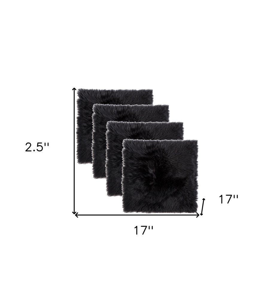 Set Of Four 17" X 17" Black Wool Chair Pads on a white background