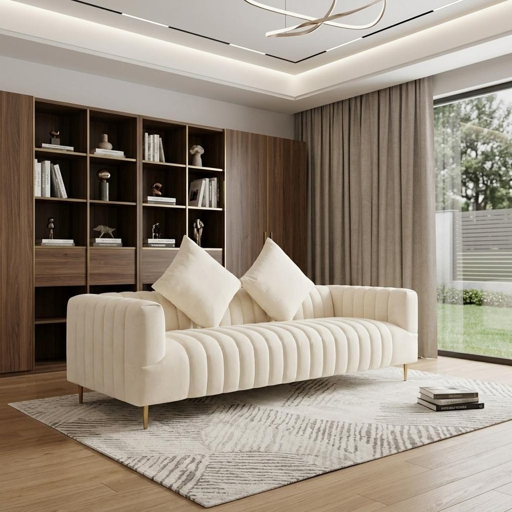 90" Ivory Velvet Sofa And Toss Pillows With Gold Legs in a home interior
