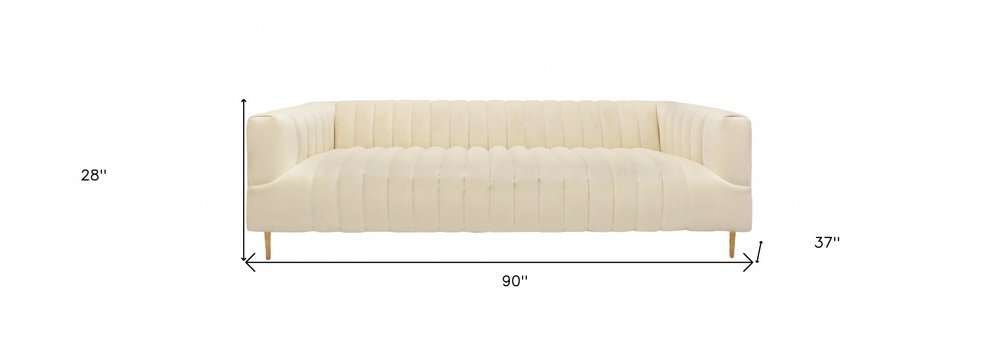 90" Ivory Velvet Sofa And Toss Pillows With Gold Legs on a white background