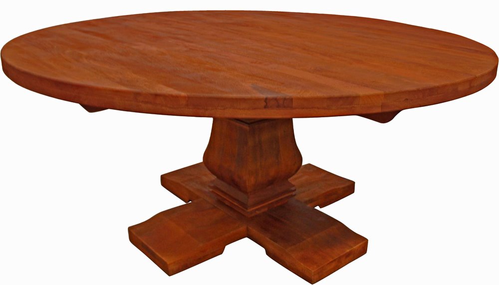 Round solid wood dining table with a pedestal base and four legs, on a white background.