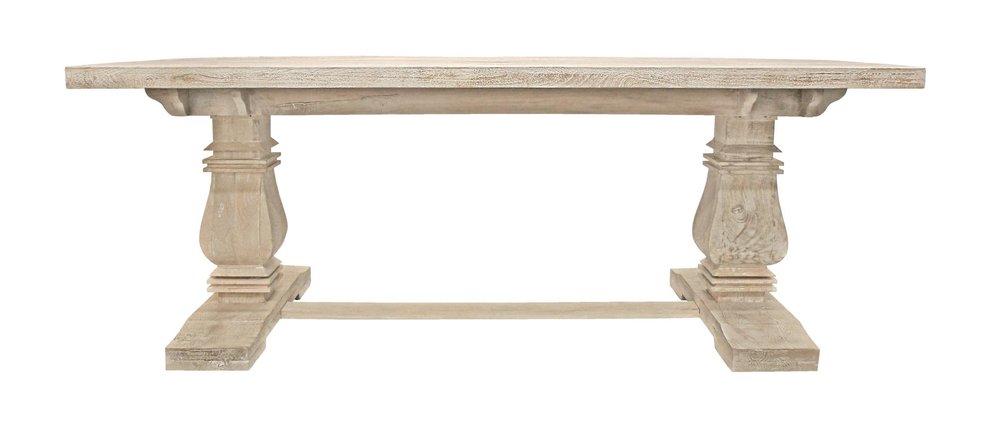 A light wood dining table with a trestle base on a white background.