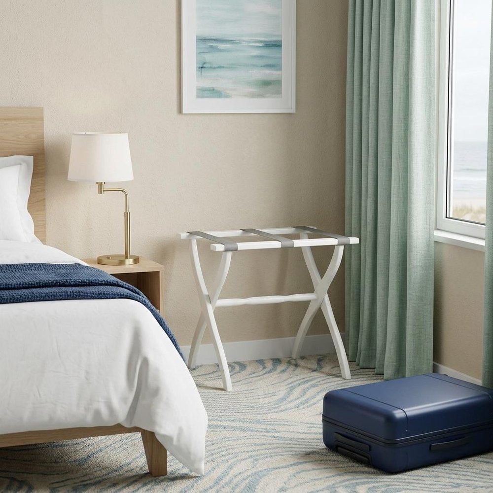 White Folding Luggage Rack With Gray Straps in a home interior