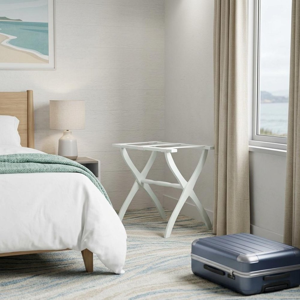 White Folding Luggage Rack With White Straps in a home interior