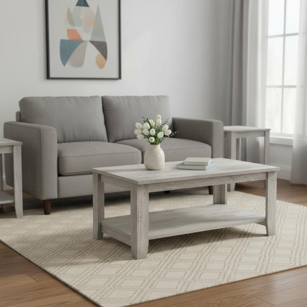 Set Of Three 42" Gray Rectangular Coffee Table With Three Shelves in a home interior